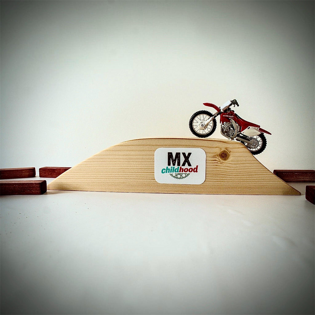 Wooden dirt bike racing track for children