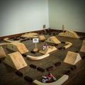 KeoMxPro dirt bike play track for kids with jumps, turns and tuff blocks arranged like a miniature motocross racing course.  Keoproracing